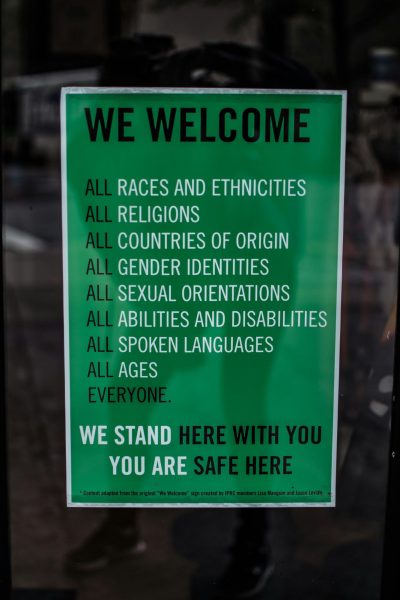 A sign welcomes people of all identities.