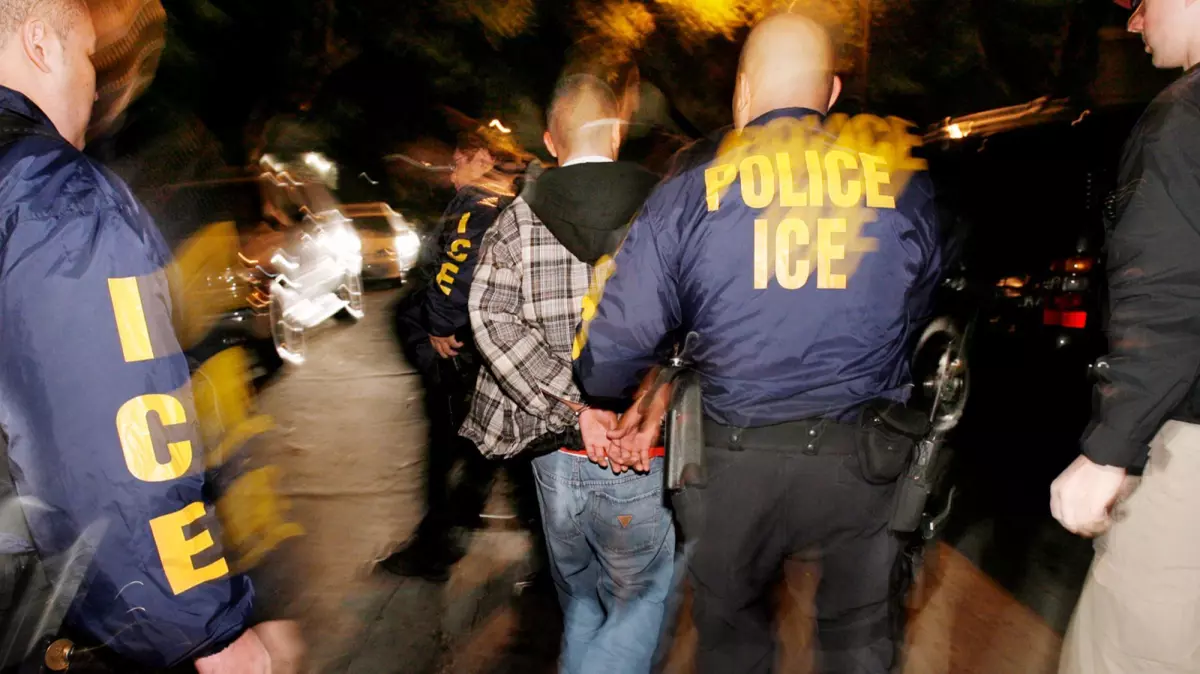 ICE agents carry out a raid in California, operations that have at times mistakenly detained U.S. citizens and fueled widespread fear in immigrant communities. Attributed to Mark Avery.