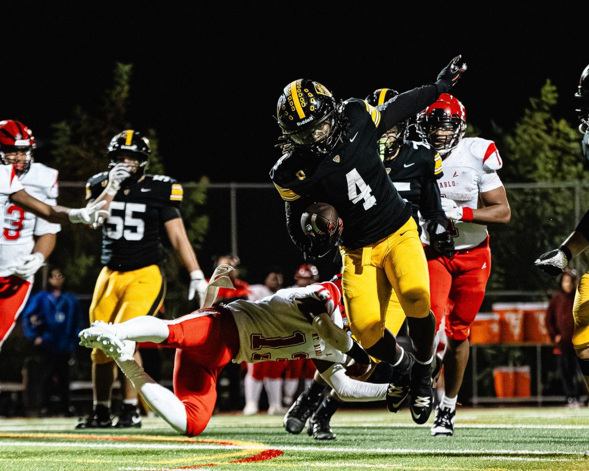 Bishop O'Dowd won the NCS Round 1 varsity football game against Mt Diablo on November 14, 2025, with a score of 24-0, shutting out the Red Devils thanks to a dominant rushing attack led by Lamar Ellis '27 and a strong defensive effort with three interceptions. 