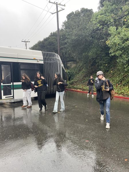 Students exit an AC Transit bus after it crashed into a telephone pole.