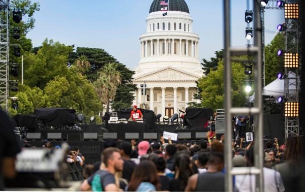 A crowd gathers outside California's capitol building. 
